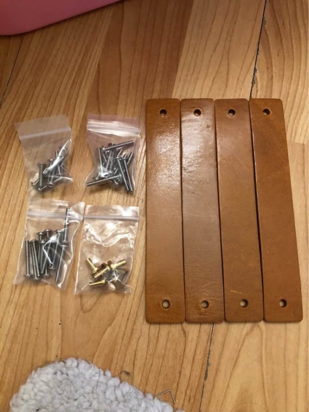 4 brown leather straps,